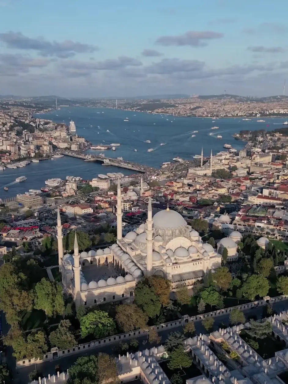 Süleymaniye Mosque above the Golden Horn and the Galata Bridge in the last light, seen from the air